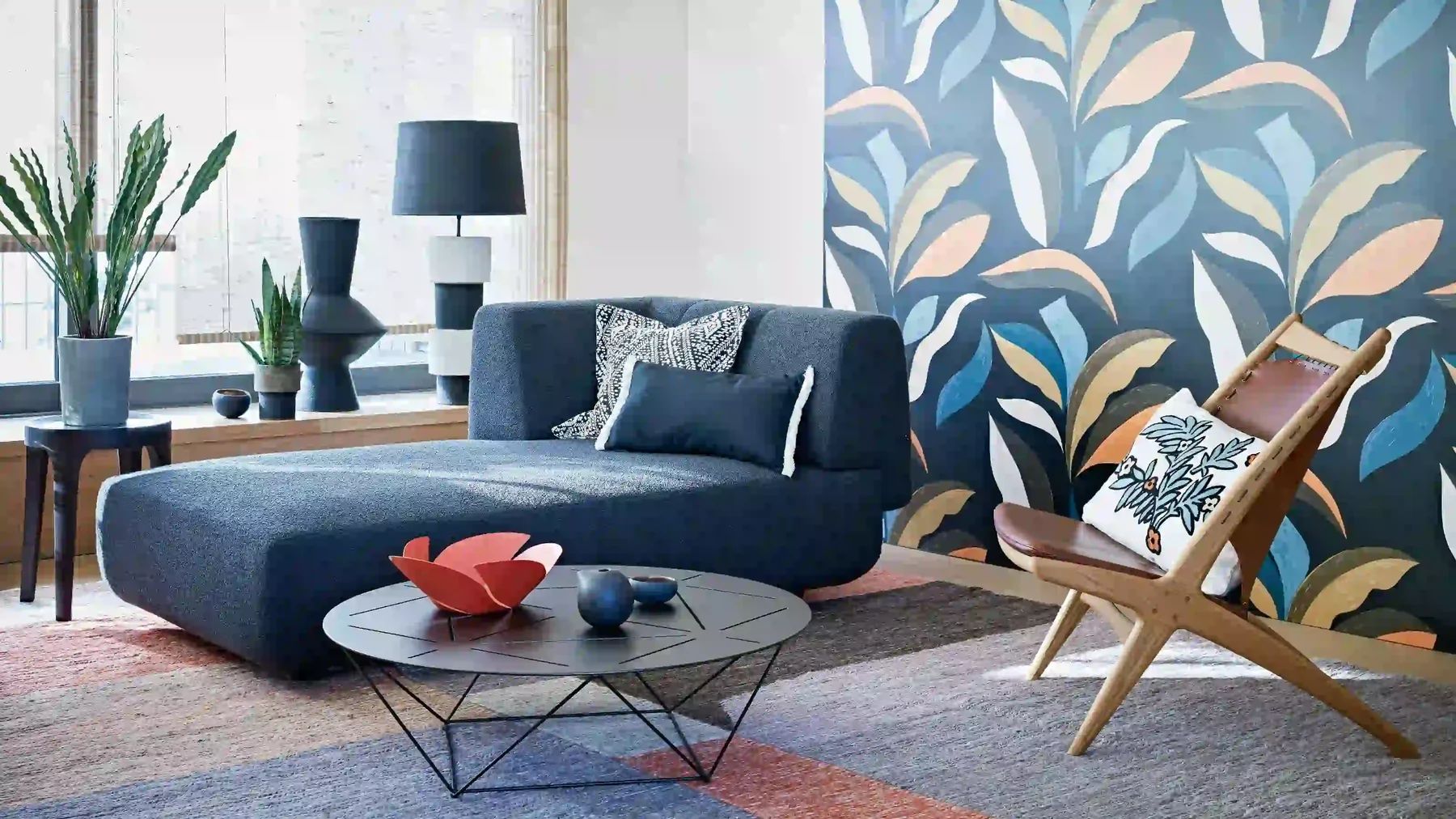 Blue botanical wallpaper framing a bright sitting room